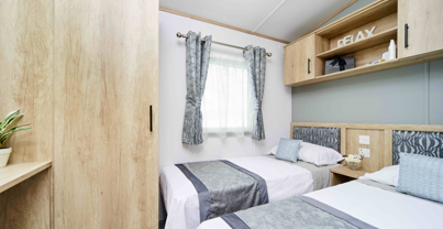 Internal of a caravan twin bedroom