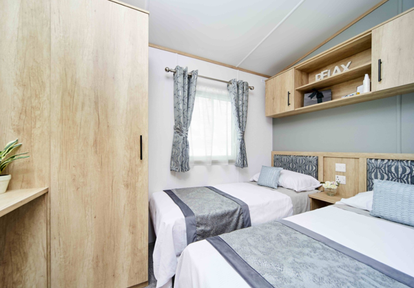Internal of a caravan twin bedroom