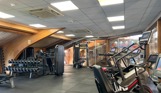 Inside of a modern gym facility with various equipment