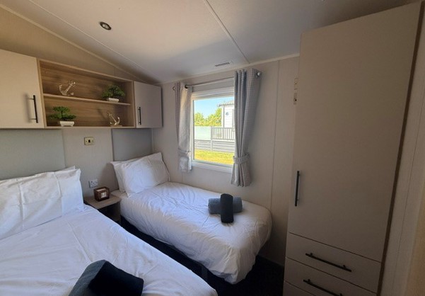 Internal of a caravan twin bedroom