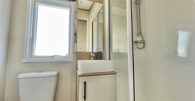 Internal of a caravan bathroom with shower toilet and sink