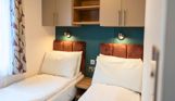 Internal of a caravan twin bedroom
