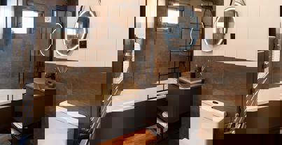 Interior of a Super Lodge Main Bathroom with Bath and Overhead Shower