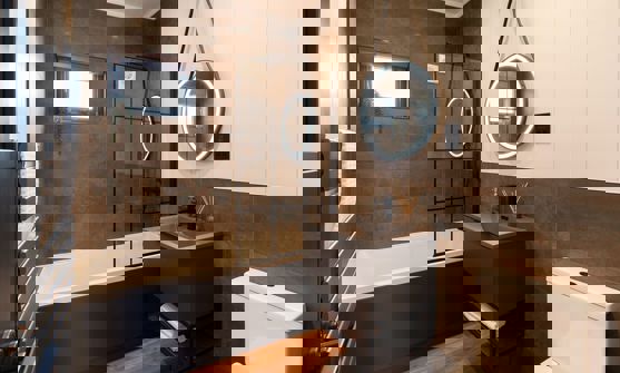 Interior of a Super Lodge Main Bathroom with Bath and Overhead Shower