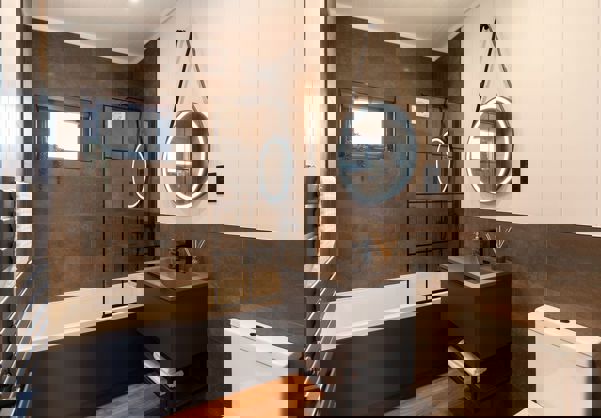 Interior of a Super Lodge Main Bathroom with Bath and Overhead Shower