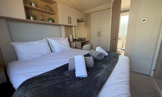 Internal of a caravan double bedroom with ensuite