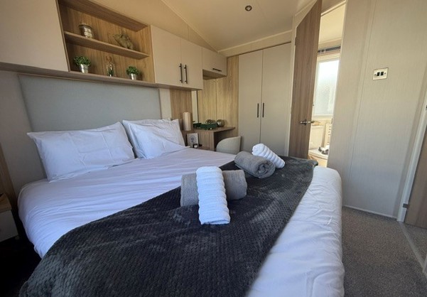 Internal of a caravan double bedroom with ensuite