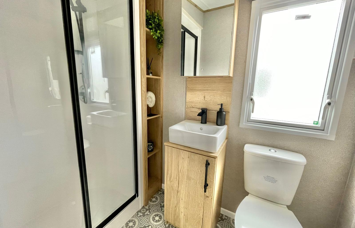 Internal of a caravan bathroom with shower sink and toilet