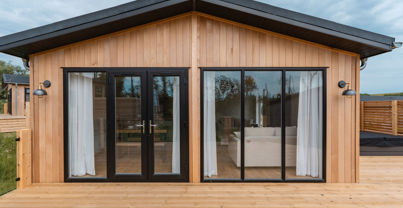 External of a luxury lodge on pitch with decking