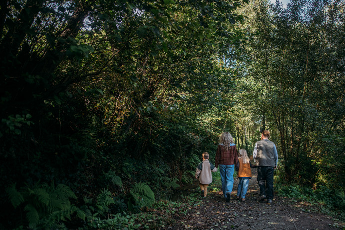 Family walking through woodland