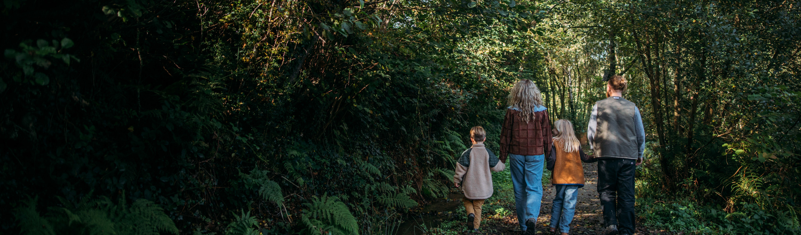 Family walking through woodland