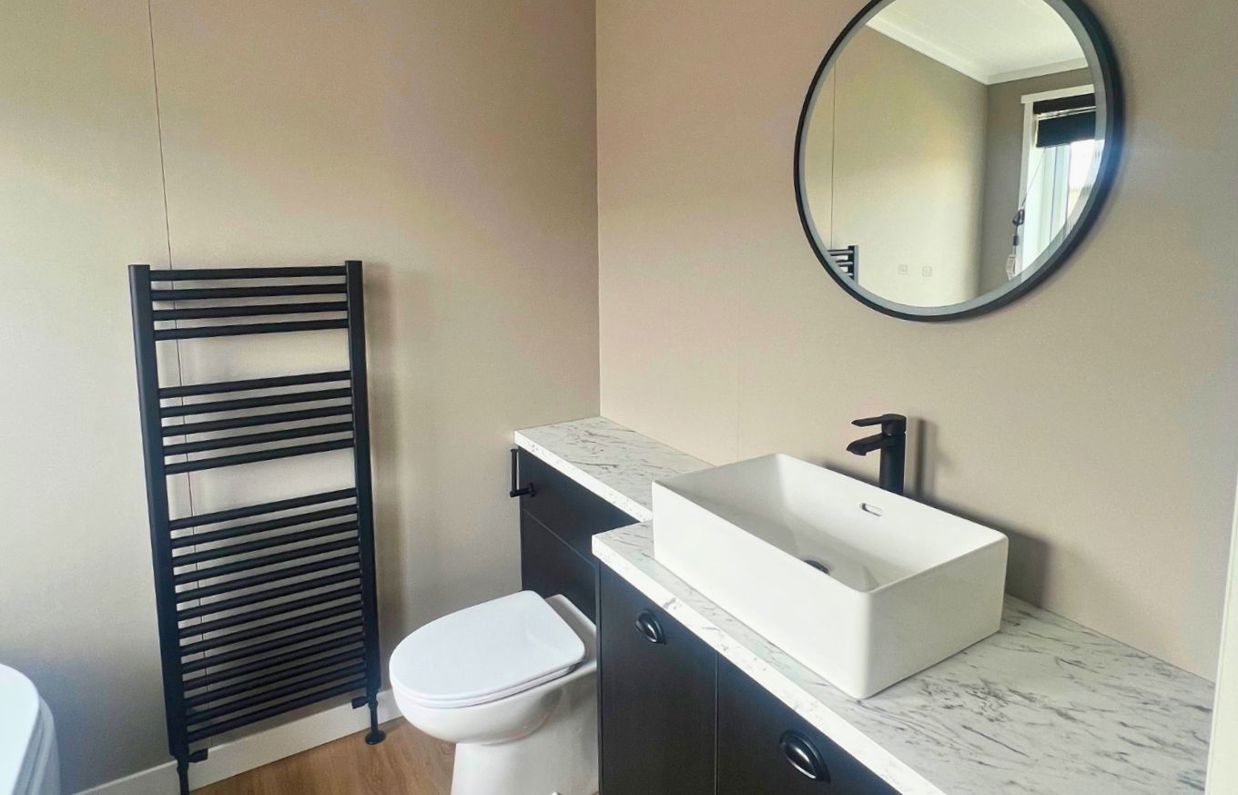 Internal of a lodge bathroom with toilet and sink