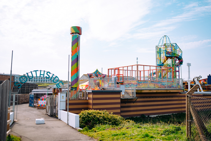 The entrance to an outdoor funfair called Southside Funfair with a range of rides and other children's entertainment