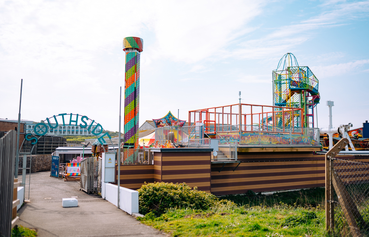 The entrance to an outdoor funfair called Southside Funfair with a range of rides and other children's entertainment