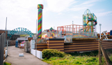 The entrance to an outdoor funfair called Southside Funfair with a range of rides and other children's entertainment