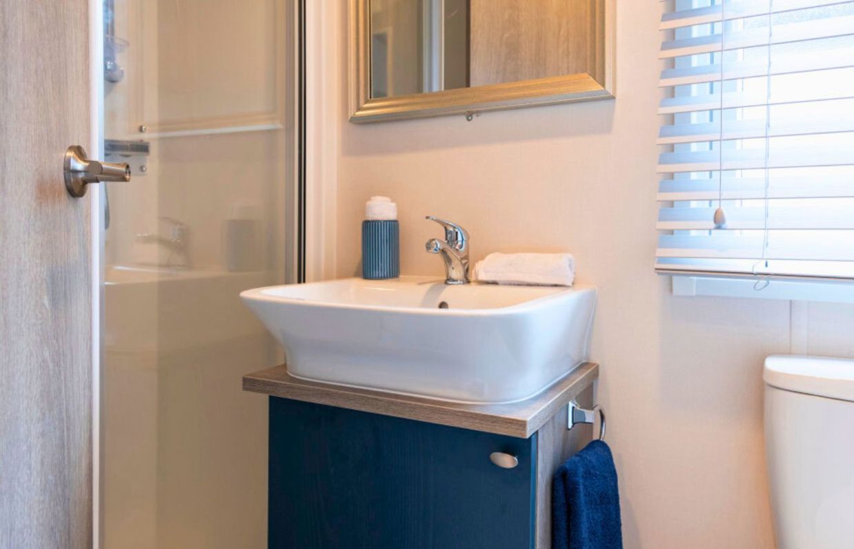 Internal of a caravan bathroom with shower and sink