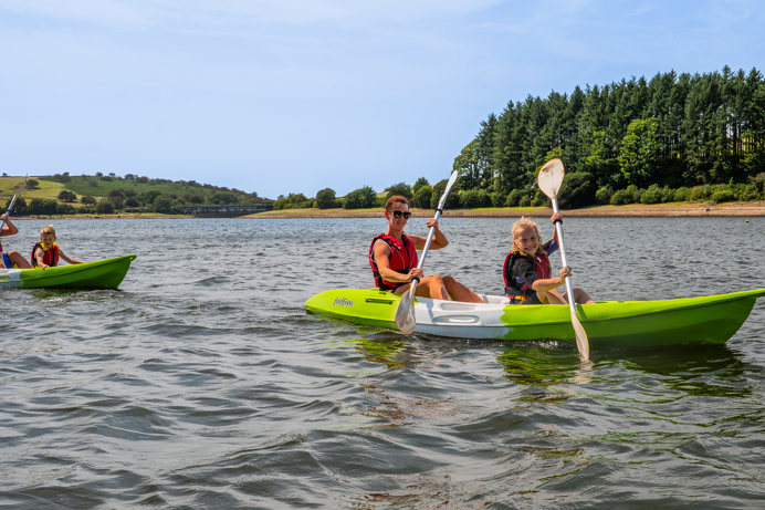 People in rowing boats on Siblyback Lake