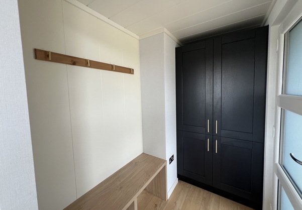 Entrance with storage cupboard, bench and coat hooks