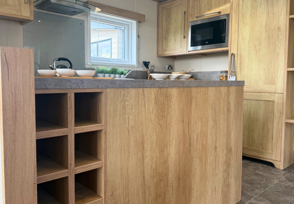 Internal of a caravan kitchen with wine rack