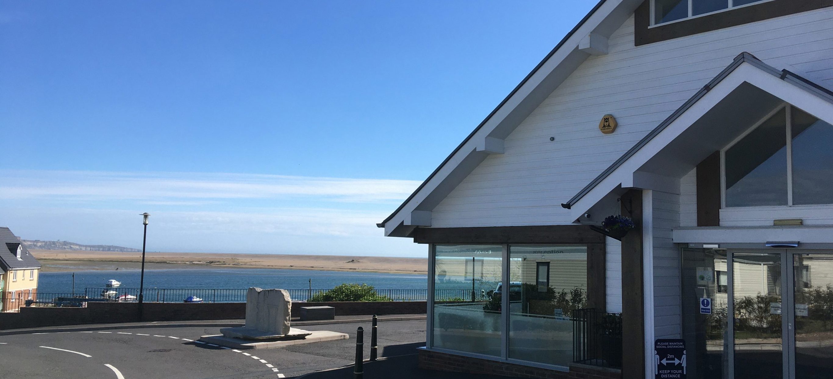 The reception at Chesil Beach containing a small shop for essentials with seaviews