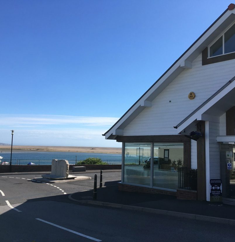 The reception at Chesil Beach containing a small shop for essentials with seaviews