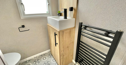 Internal of a caravan bathroom with sink and toilet