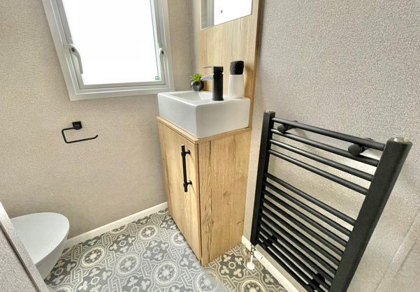 Internal of a caravan bathroom with sink and toilet