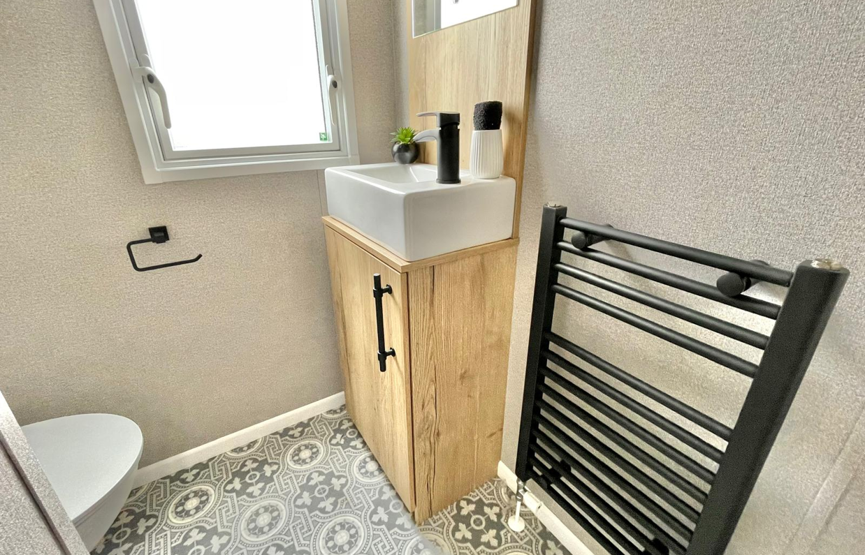 Internal of a caravan bathroom with sink and toilet