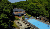 Aerial view of the country club and heated outdoor pool