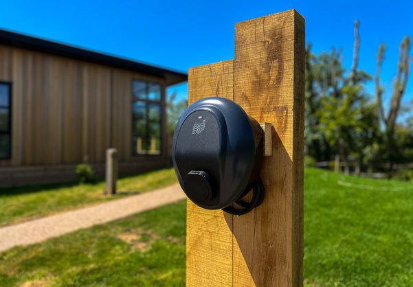 External of a luxury lodge on pitch with EV charging 
