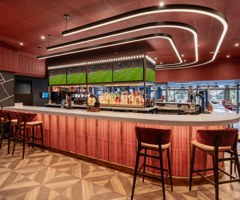 The bar area at the arena sports bar with football on the TVs