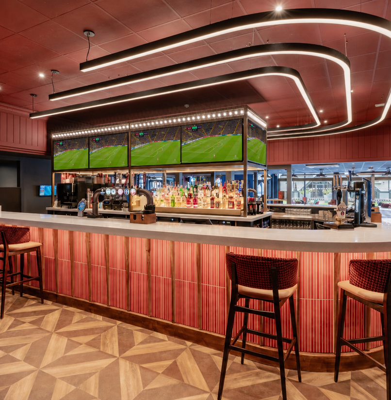 The bar area at the arena sports bar with football on the TVs