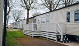 External of a caravan on pitch with decking