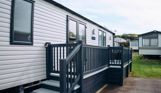 External of a caravan on pitch with decking