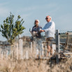 Elder couple relaxing on deck of Stables Lodge