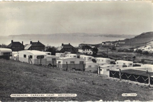 An old fashioned black and white photo of an old caravan park