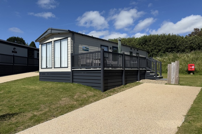 External of a caravan on pitch with decking