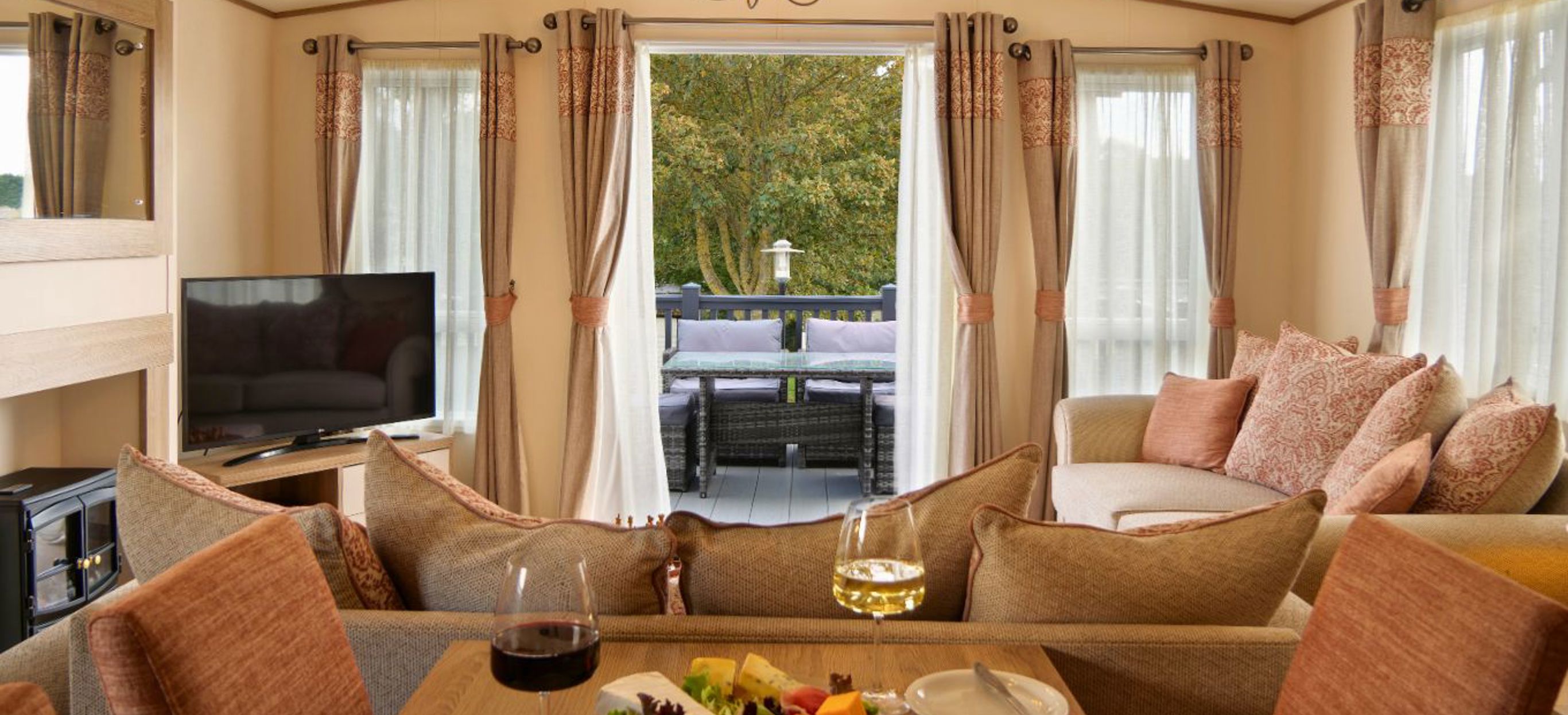 Internal of a caravan open plan living space out to decking