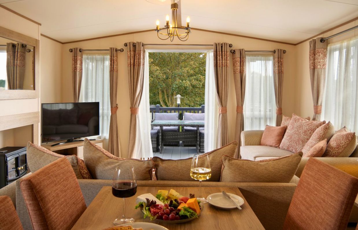 Internal of a caravan open plan living space out to decking