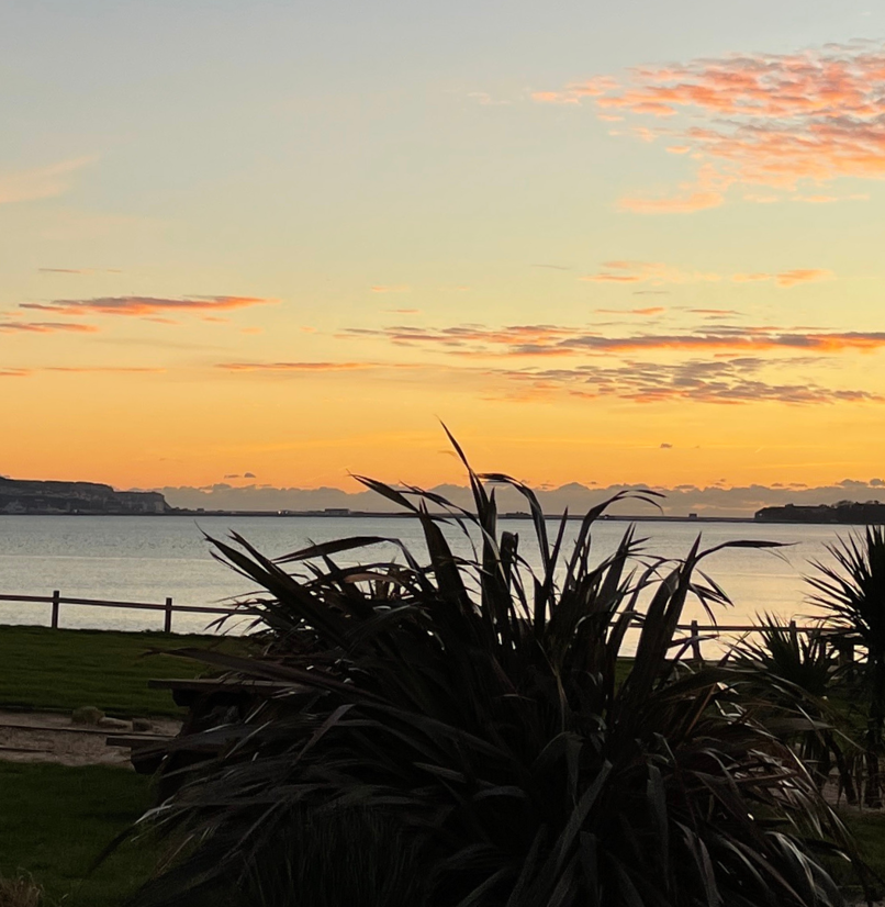 View of Bowleaze Cove at sunset