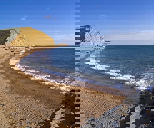 A coastline with high cliffs, rocks and sea views