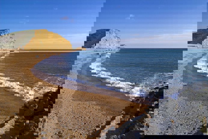 A coastline with high cliffs, rocks and sea views