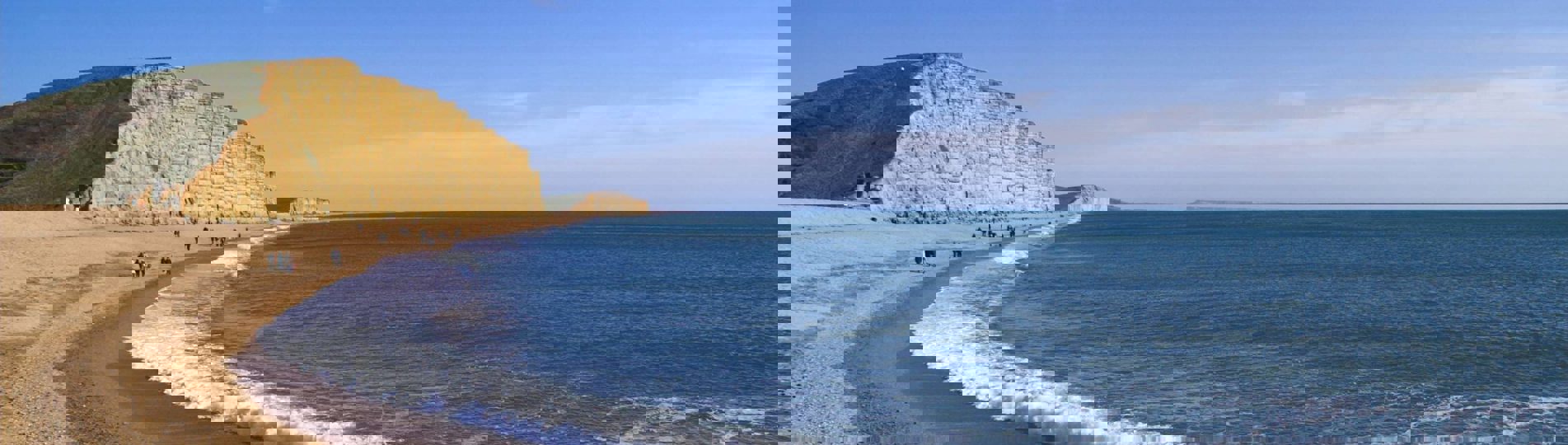 A coastline with high cliffs, rocks and sea views