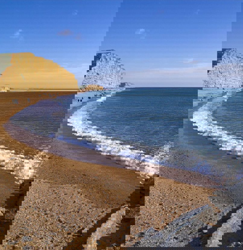 A coastline with high cliffs, rocks and sea views