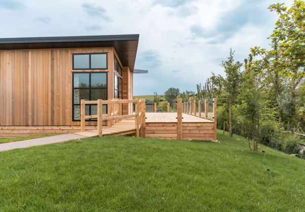 External of a luxury lodge on pitch with decking