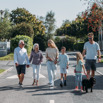 Multi generational family walking through park