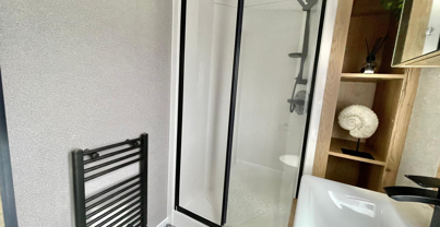 Internal of a caravan bathroom with shower and sink