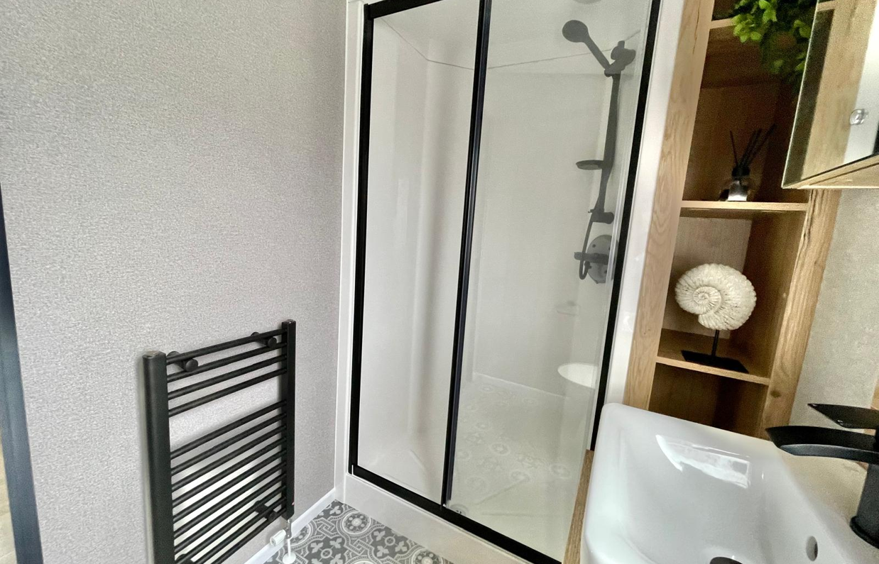 Internal of a caravan bathroom with shower and sink