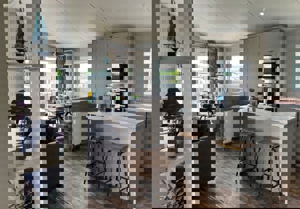 View from entrance across open plan kitchen and dining area