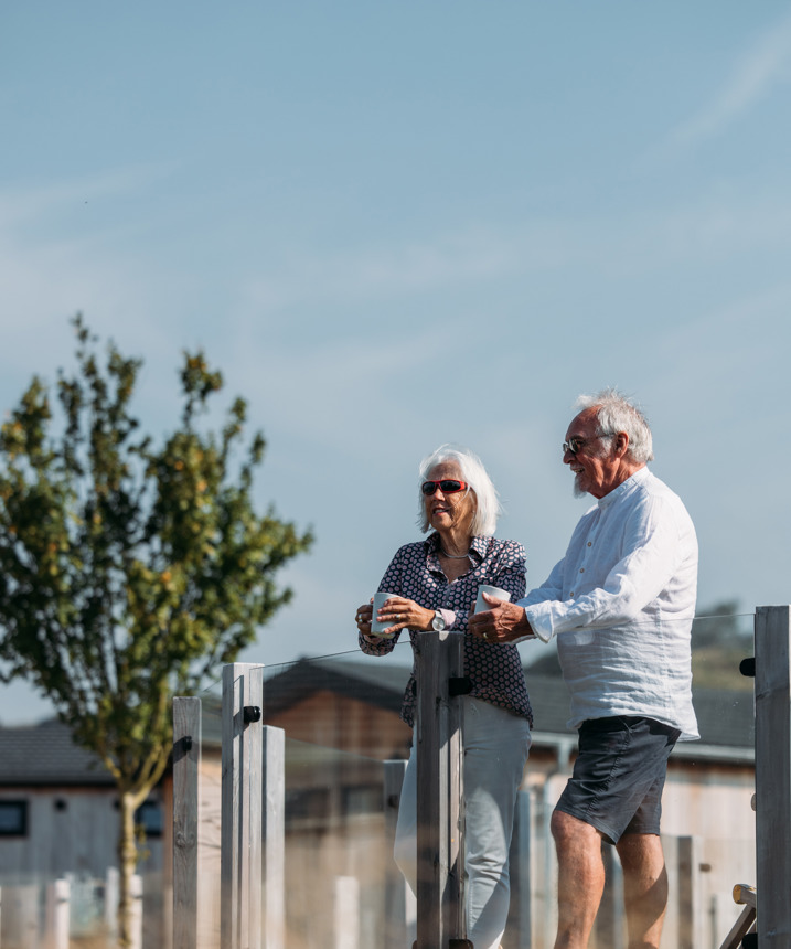 Elder couple relaxing on deck 